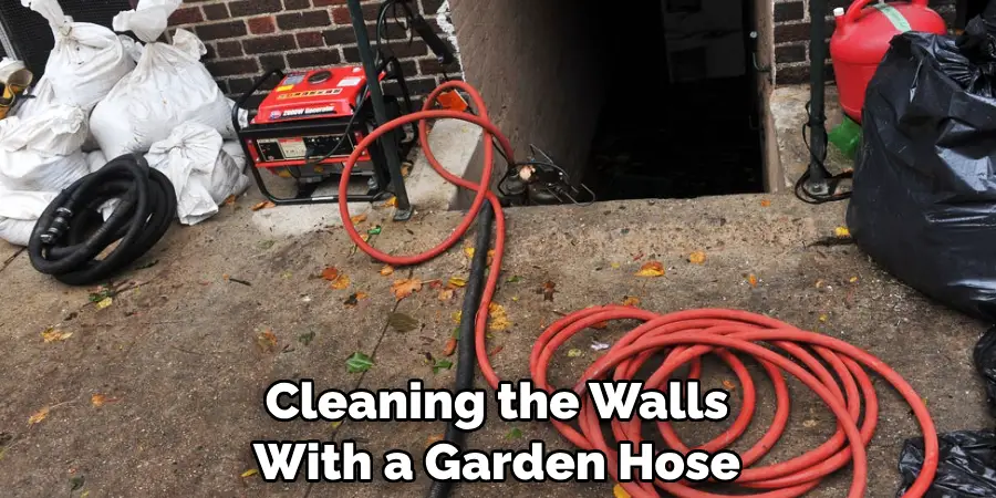 Cleaning the Walls With a Garden Hose